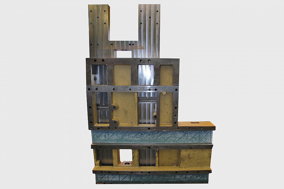 Bed slide assembly made of high-grade cast iron. Counterstay to the Z-axis occupied with Turcite guide and bedded in.